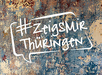 Das Logo zeigt die Worte "Zeig's mir Thüringen" in weißer Schrift auf blauem Hintergrund.